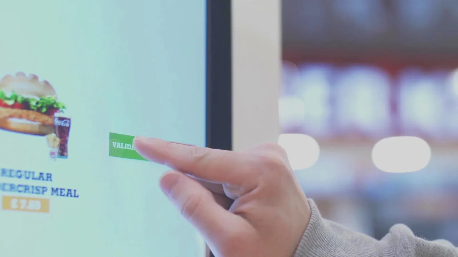 A guest ordering on a self-order kiosk